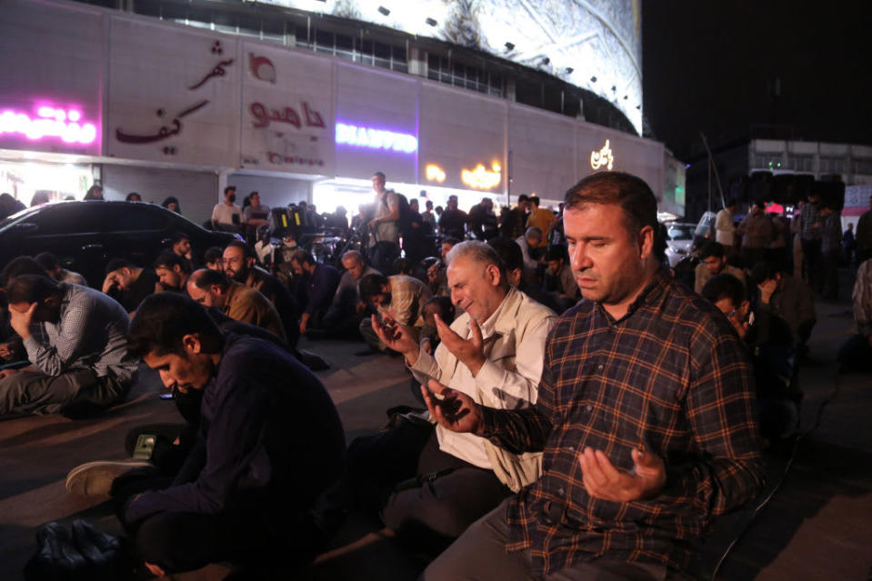 Iranians pray for the President Ebrahim Raisi and his delegation following a helicopter crash. 