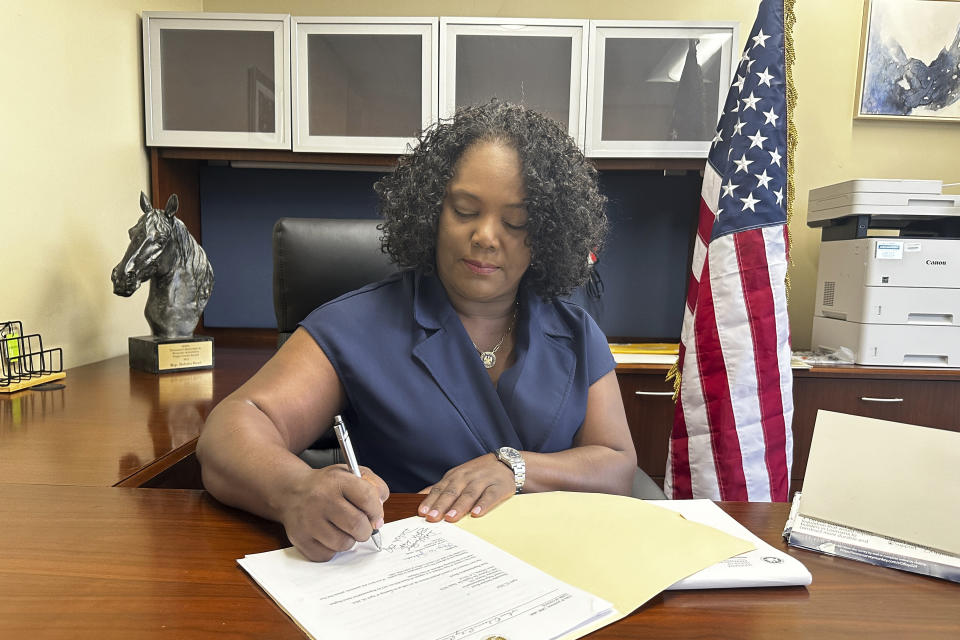 Louisiana Democratic state Rep. Delisha Boyd works at her desk at her office May 3, 2024, in New Orleans. As Boyd faces an uphill battle in Louisiana, as she attempts to advance a bill that would add cases of rape and incest as exceptions to Louisiana's near total abortion ban, the Democrat opens opening up about her mother's harrowing story and how it effected them. (AP Photo/Stephen Smith)