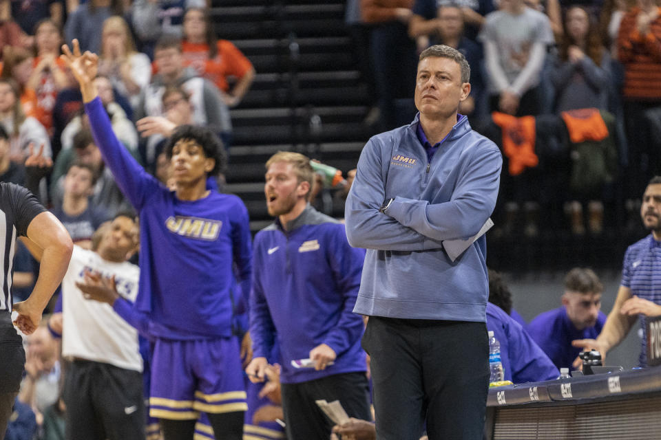 James Madison coach Mark Byington watches during the first half of an NCAA college basketball game against James Madison in Charlottesville, Va., Tuesday, Dec. 6, 2022. (AP Photo/Erin Edgerton)