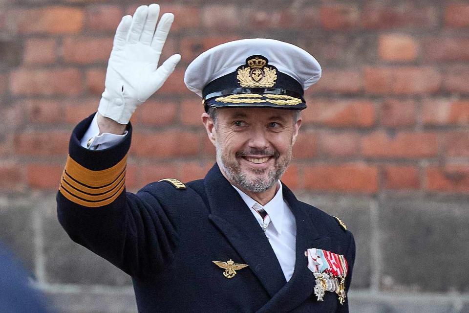 <p>MIKKEL BERG PEDERSEN/Ritzau Scanpix/AFP via Getty</p> King Frederik X greets the crowd after a church service at Aarhus Cathedral on Jan. 21.