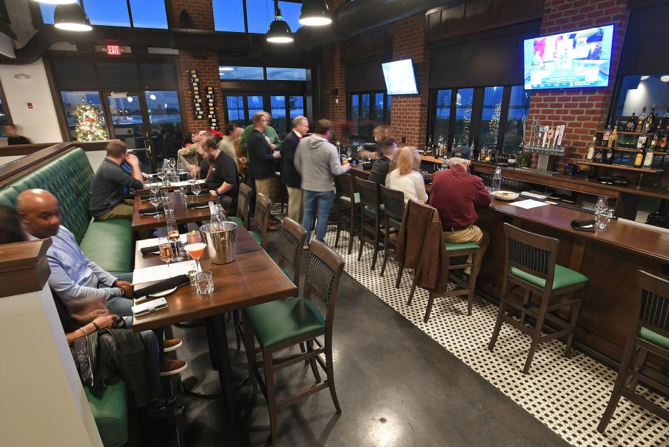 The bar area of the Bay House Oyster Bar & Restaurant, 6 Sassafras Pier on Erie's bayfront, was hopping on opening night Dec. 10.