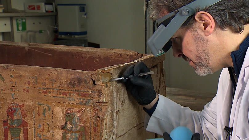 Ignacio Martinez photographed carrying out restoration work on the ancient Egyptian coffin