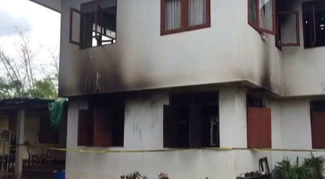 The remains of the school dormitory in northern Thailand after a blaze destroyed it on Sunday night. Photo: TV Thailand/AP