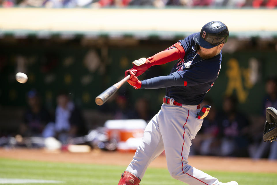 Boston Red Sox's Alex Verdugo (99) connects for a double against the Oakland Athletics during the third inning of a baseball game, Sunday, July 4, 2021, in Oakland, Calif. (AP Photo/D. Ross Cameron)