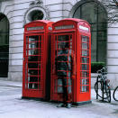 Liu Bolin camouflages himself against an iconic red London telephone box as part of his 'Hiding in the City' collection.