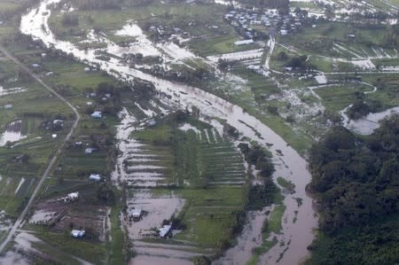 Floodwaters cover the landscape around Fiji's capital Suva in this aerial picture taken from a Royal Australian Air Force C-17A aircraft landing to assist with Cyclone Winston recovery efforts, February 22, 2016. REUTERS/Australian Defence Force