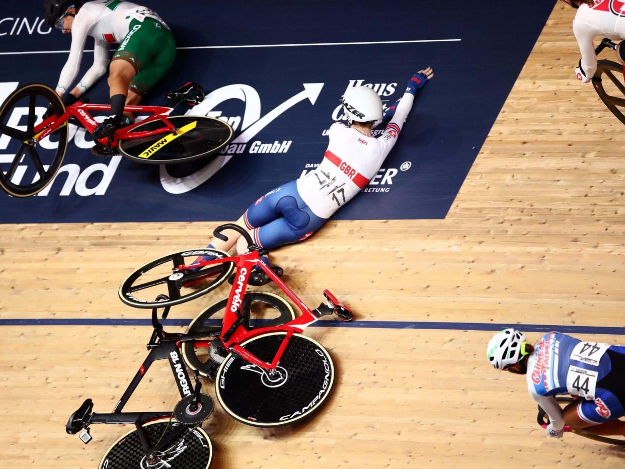 Great Britain's Laura Kenny crashes whilst riding the Women's Omnium Scratch Race: Tim Goode/PA Wire