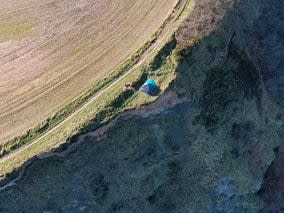 <p>A family with a child was seen camping dangerously close to a cliff edge on Cleveland Way, North Yorkshire, on 27 February</p> (Alastair Smith/HM Coastguard)