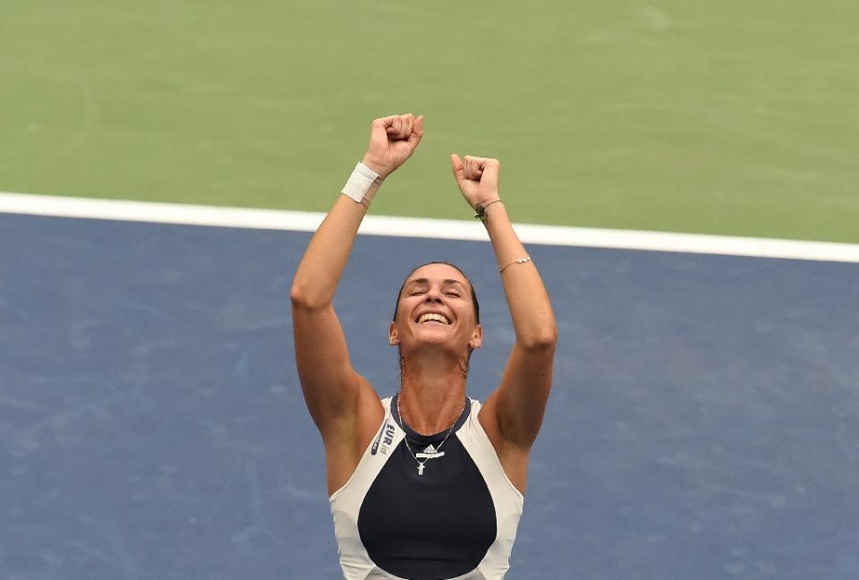 Flavia Pennetta of Italy celebrates defeating her compatriot Roberta Vinci during their 2015 US Open Women&#39;s singles final match at the USTA Billie Jean King National Tennis Center in New York on September 12, 2015 (AFP Photo/Jewel Samad)