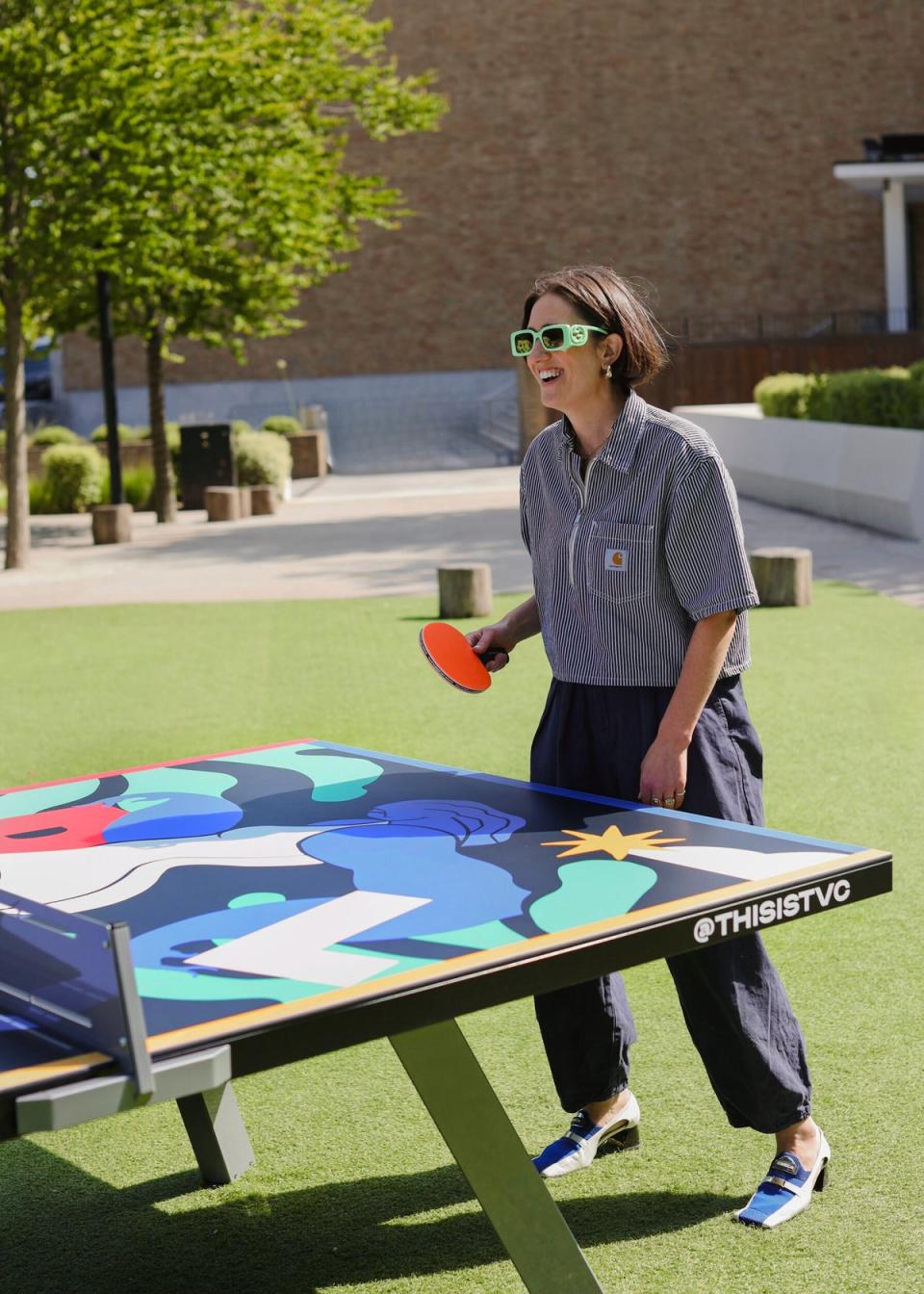 Renowned artist Kelly Anna enjoying her work of art (Television centre)