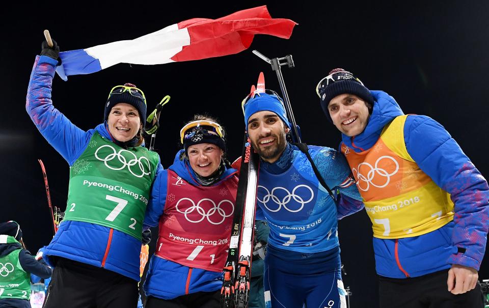 <p>Gold medallistsFrance’s Anais Bescond, France’s Marie Dorin Habert, France’s Martin Fourcade and France’s Simon Desthieux celebrate during the victory ceremony in the mixed relay biathlon event during the Pyeongchang 2018 Winter Olympic Games on February 20, 2018, in Pyeongchang. (Getty) </p>