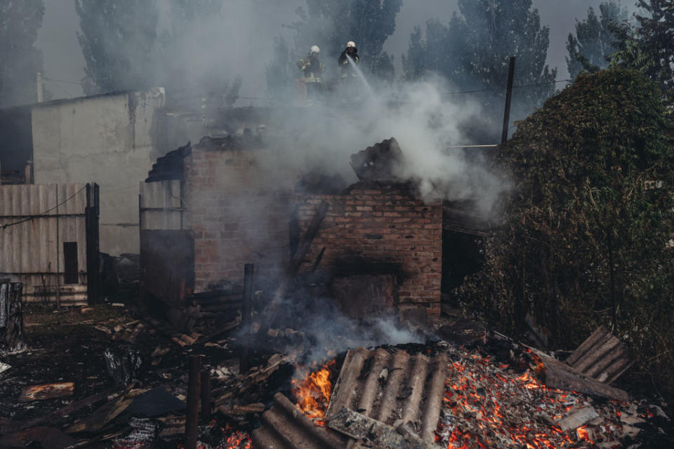 Firefighters extinguish a fire that broke out after the shelling, as the Russia-Ukraine war continues in Opytne, Donetsk Oblast, Ukraine on August 01, 2022.<span class="copyright">Diego Herrera Carcedo-Anadolu Agency/Getty Images</span>