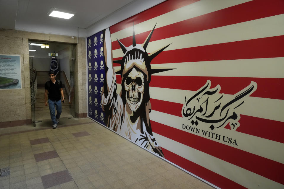 A man walks through the former U.S. Embassy, which has been turned into an anti-American museum in Tehran, Iran, on Saturday, Aug. 19, 2023. Seventy years after a CIA-orchestrated coup toppled Iran’s Prime Minister Mohammad Mossadegh, its legacy remains contentious and complicated for the Islamic Republic as tensions stay high with the United States. (AP Photo/Vahid Salemi)