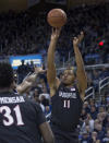 San Diego State forward Matt Mitchell (11) shoots against Nevada in the first half of an NCAA college basketball game in Reno, Nev., Saturday, March 9, 2019. (AP Photo/Tom R. Smedes)