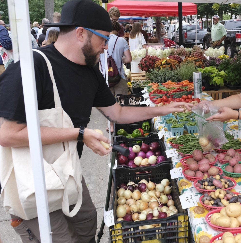 Milwaukee chef Dan Jacobs shops for ingredients at the Dane County Famers Market to make a Quickfire Challenge dish centered around a classic recipe for tartar sauce on Episode 5 of "Top Chef: Wisconsin."