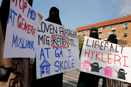 Women in niqabs gather at a demonstration against the Danish face veil ban in Copenhagen, Denmark, August 1, 2018. REUTERS/Andrew Kelly