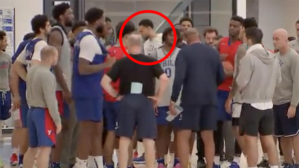 Ben Simmons is pictured at the back of the 76ers team huddle after practice.