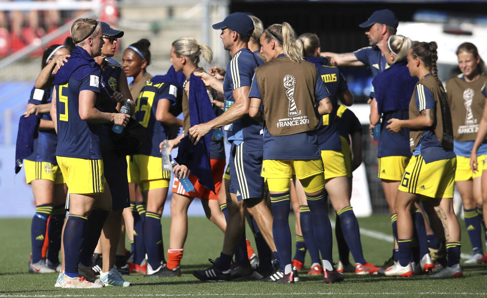 Sweden's players take a drinks brake during the of the Women's World Cup quarterfinal soccer match between Germany and Sweden at Roazhon Park in Rennes, France, Saturday, June 29, 2019. (AP Photo/David Vincent)