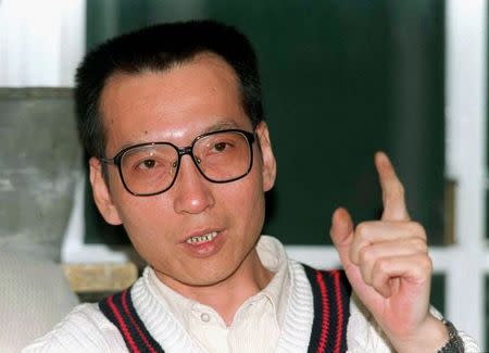 Liu Xiaobo makes a point during a March 1995 file photo. REUTERS/Will Burgess/Files