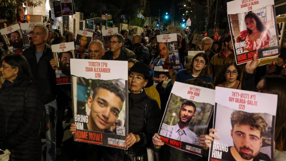 PHOTO: Protestors hold up portraits during a rally organized by family and supporters of Israeli hostages held in Gaza to demand their release, Jan. 22, 2024, near the residence of the Israeli prime minister in Jerusalem. (Ahmad Gharabli/AFP via Getty Images)