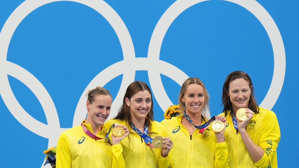 Cate Campbell (r) after winning 4x100m freestyle gold at Tokyo Games.