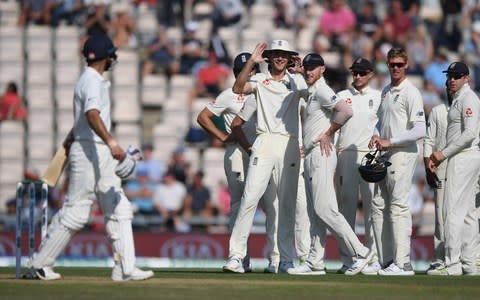 India captain Virat kohli (l) leaves the field after being given out after review as Stuart Broad and the England fielders react during the 4th Specsavers Test Match between England and India at The Ageas Bowl - Credit: getty images