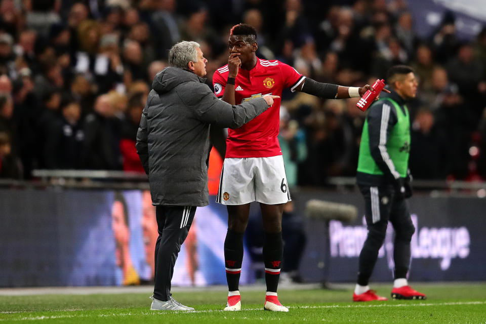 Jose Mourinho and Paul Pogba argue with each other during Manchester United’s 2-0 loss to Tottenham. (Getty)