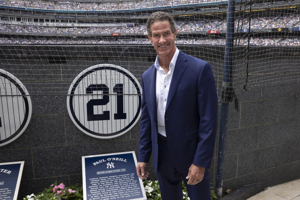 Retired New York Yankees player Paul O'Neill stands next to his number in Monument Park during a number retirement ceremony before a baseball game between the Yankees and the Toronto Blue Jays, Sunday, Aug. 21, 2022, in New York. (AP Photo/Corey Sipkin)