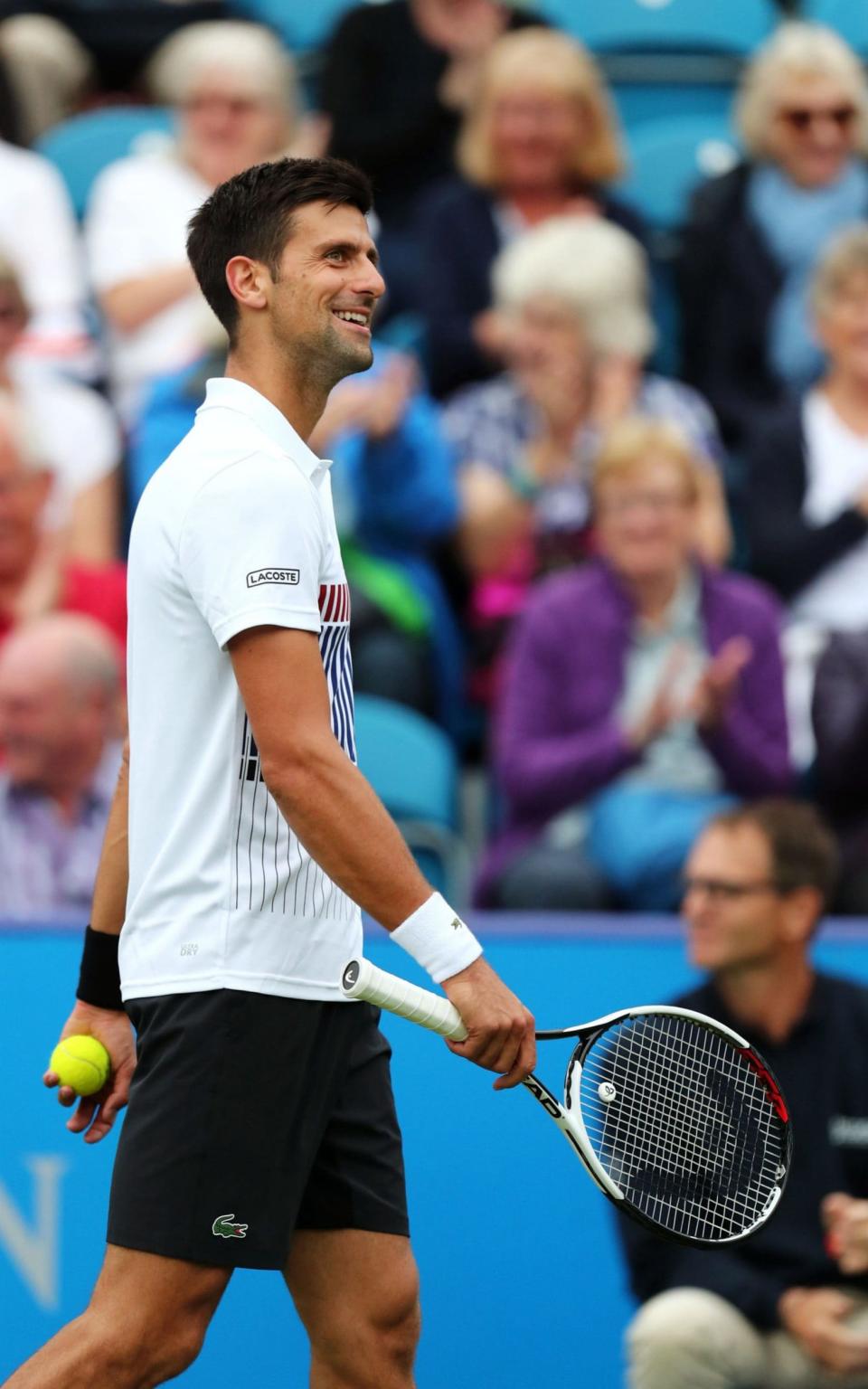 Djokovic smiles at a dubious Hawk-eye replay