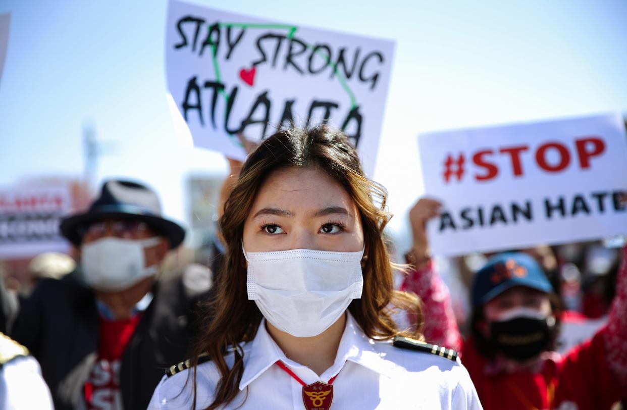 People demonstrate at the 'Stop Asian Hate March and Rally' in Koreatown on March 27, 2021 in Los Angeles, California. March 27 is the #StopAsianHate  National Day of Action against anti-Asian violence.