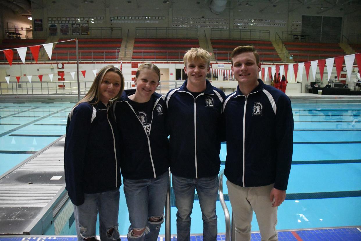 Chambersburg swimming's Maddie Shifler, Margot Ritchie, Jed Ritchie and Derek Estep pose for a photo at Mid-Penn Media Day at Cumberland Valley High School on Tuesday, November 7, 2023.