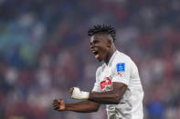 Switzerland's Breel Embolo celebrates after his teammate Switzerland's Remo Freuler scored his side's third goal during the World Cup group G soccer match between Serbia and Switzerland, at the Stadium 974 in Doha, Qatar, Friday, Dec. 2, 2022. (AP Photo/Petr David Josek)