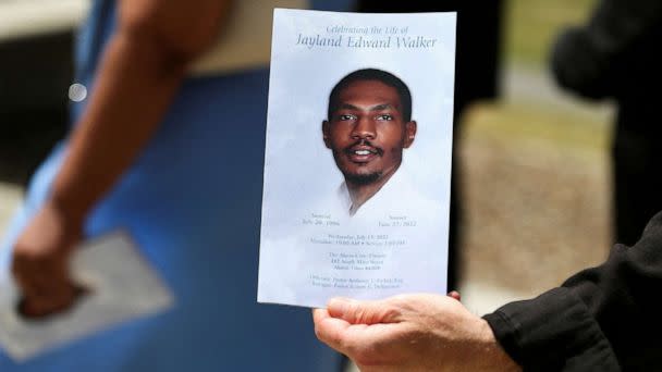 PHOTO: In this July 13, 2022, file photo, a man holds up the program following the funeral services for Jayland Walker, a 25 year old black man was shot to death by up to eight police officers on June 27, 2022, in Akron, Ohio. (Aaron Josefczyk/Reuters, FILE)