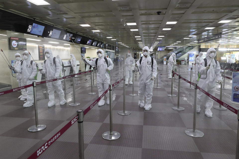 South Korean army soldiers wearing protective suits spray disinfectant to prevent the spread of the new coronavirus at Daegu International Airport in Daegu, South Korea, Friday, March 6, 2020. Seoul expressed “extreme regret” Friday over Japan’s ordering 14-day quarantines on all visitors from South Korea due to a surge in viral infections and warned of retaliation if Tokyo doesn’t withdraw the restrictions. (Kim Joo-sung/Yonhap via AP)