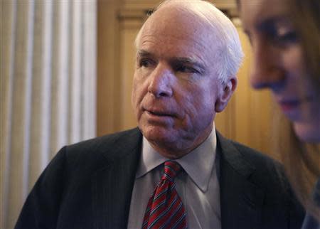 U.S. Senator John McCain (R-AZ) talks to reporters after a Senate cloture vote on budget bill on Capitol Hill in Washington December 17, 2013. REUTERS/Yuri Gripas