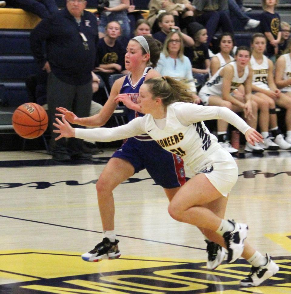 Mooresville senior Madelynn Denny beats wins on a loose ball during Tuesday's Mid-State Conference game against Martinsville.