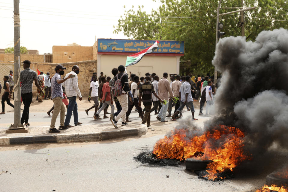 Sudanese take part in a protest over economic conditions, in Khartoum, Sudan, Wednesday, June 30, 2021. The World Bank and the International Monetary Fund said in a joint statement Tuesday, that Sudan has met the initial criteria for over $50 billion in foreign debt relief, another step for the East African nation to rejoin the international community after nearly three decades of isolation. (AP Photo/Marwan Ali)