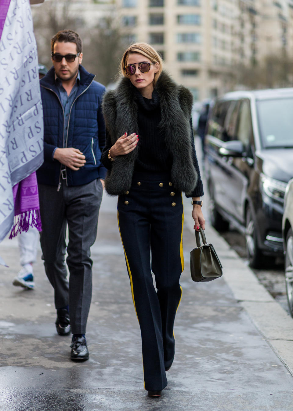<strong>Olivia Palermo in Joseph and Elie Saab:</strong> Palermo strikes again, this time in a more minimalist outfit. The statement here is the (hopefully faux) fur shawl and the button details on her pants. While the look is understated,&nbsp;the fit and styling are spot-on, making it one outfit to remember.