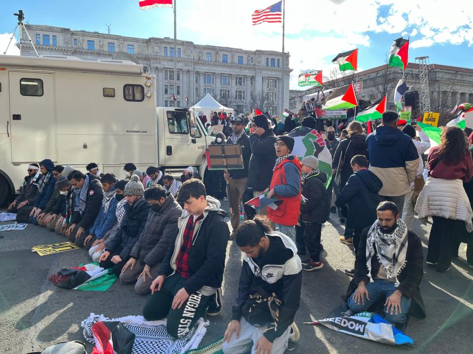 Dozens prayed, some kneeling on their keffiyehs, on Pennsylvania Avenue at the north side of Freedom Plaza in Washington, D.C., during a Muslim prayer at the "March for Gaza" on Saturday, Jan. 13, 2024.