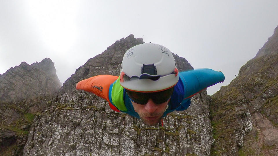 A brave base jumper has become the first person ever to fly a wingsuit from the top of a British mountain. Former Royal Marine Tim Howell, 31, leapt from the 4,000ft peak of An Teallach in the northwest Highlands in Scotland. He plunged down a steep gully for 30 seconds before deploying his parachute and landing safely on the banks of Loch Toll an Lochain.