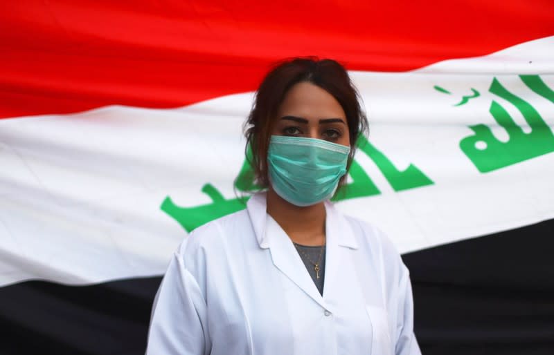 Abeer, a medical volunteer, poses for a photograph during the ongoing anti-government protests in Baghdad