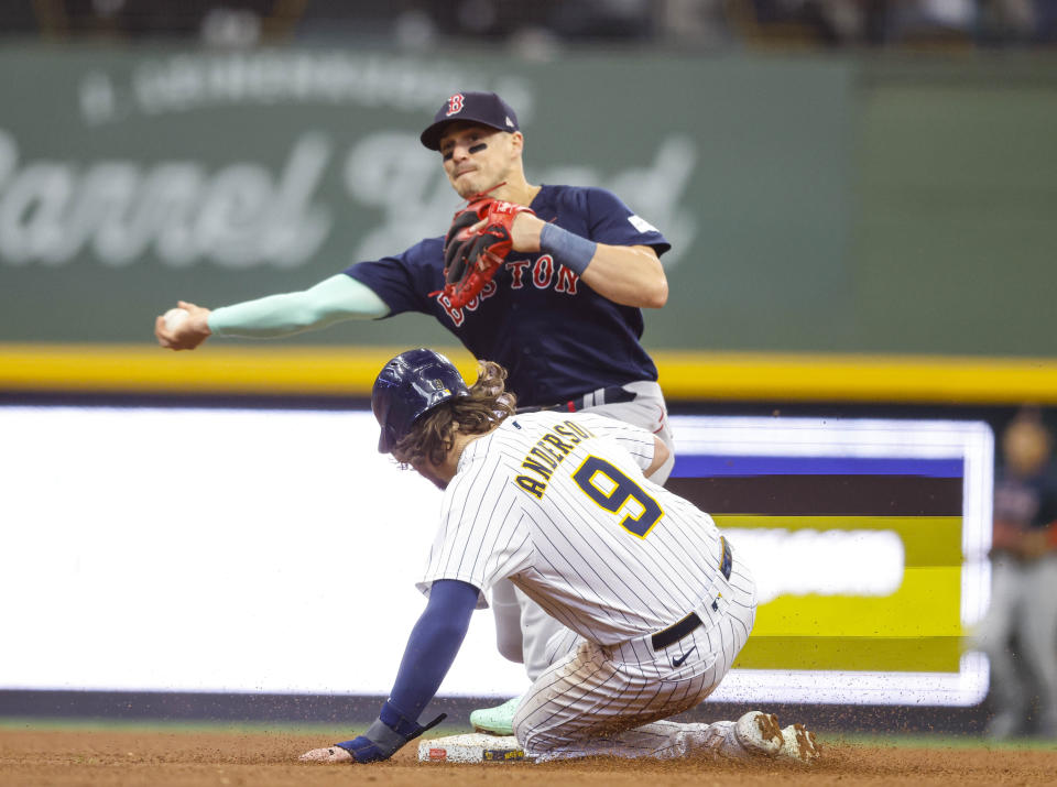 Boston Red Sox second baseman Mike Hernandez forces out Milwaukee Brewers' Brian Anderson during the sixth inning of a baseball game, Sunday, April 23, 2023, in Milwaukee. (AP Photo/Jeffrey Phelps)