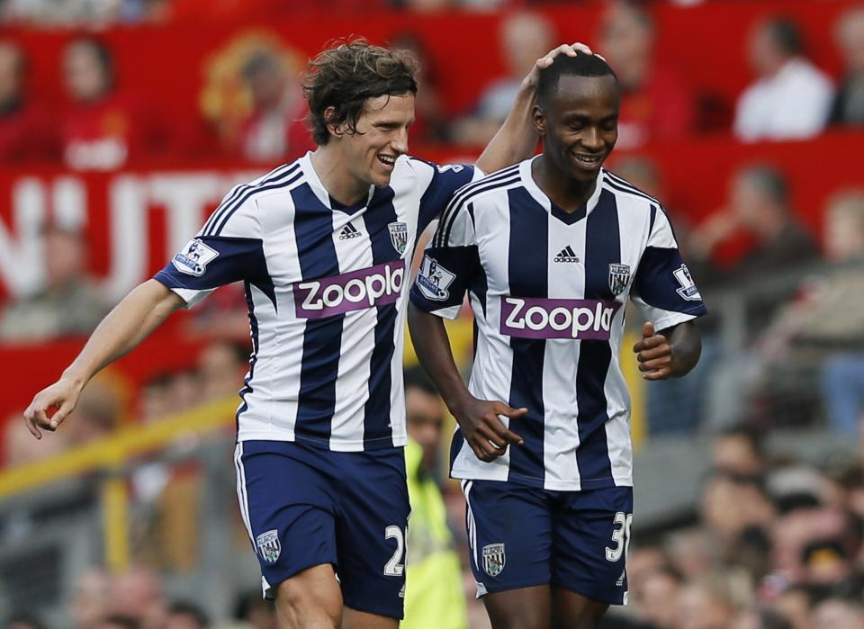 West Bromwich Albion's Saido Berahino (R) celebrates with team mate Billy Jones after scoring a goal against Manchester United. (REUTERS/Phil Noble)