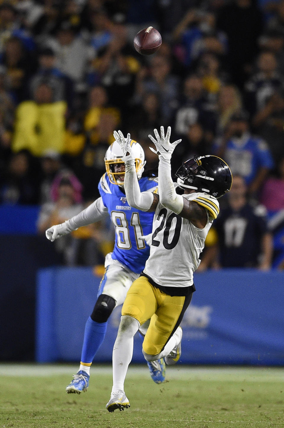 Pittsburgh Steelers cornerback Cameron Sutton, right, catches intercepts a pass intended for Los Angeles Chargers wide receiver Mike Williams during the second half of an NFL football game, Sunday, Oct. 13, 2019, in Carson, Calif. (AP Photo/Kelvin Kuo)