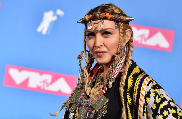 <p>ANGELA WEISS/AFP via Getty</p> Madonna poses in the press room at the 2018 MTV Video Music Awards at Radio City Music Hall on August 20, 2018 in New York City