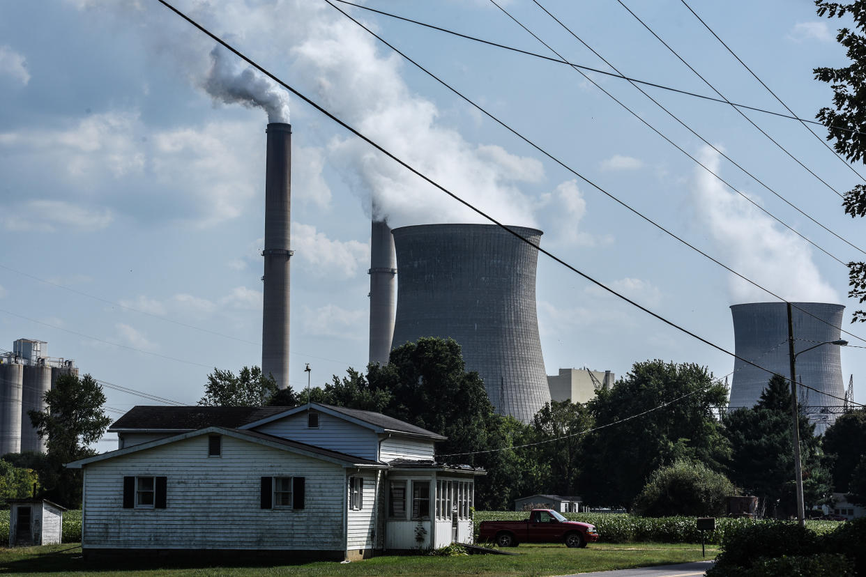 A house near a power plant in Cheshire, Ohio, in 2019.   (Stephanie Keith / Getty Images)