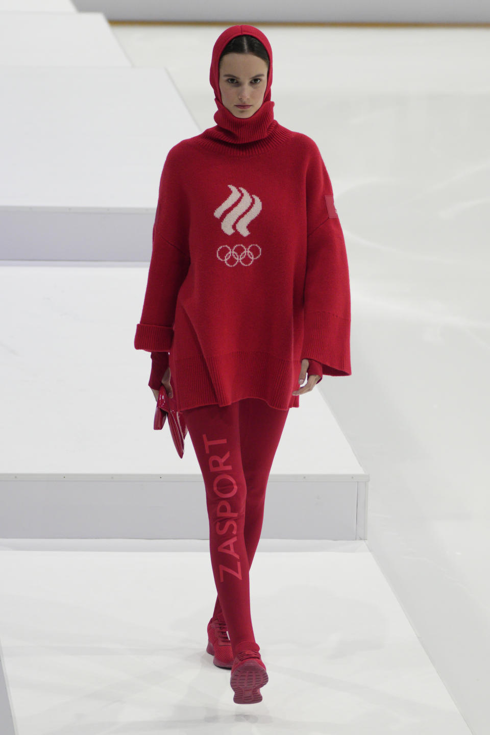 A model displays the Olympic uniforms for Russian athletes in Moscow, Russia, Friday, Dec. 10, 2021. Russia presents its Olympic kit for the Beijing Winter Olympics 2022, which shouldn't depict any symbols of the country. Russian athletes will compete at the Tokyo Olympics as neutral after the Court of Arbitration for Sport last December banned Russia from using its name, flag and anthem at any world championships because of state-backed doping. (AP Photo/Pavel Golovkin)