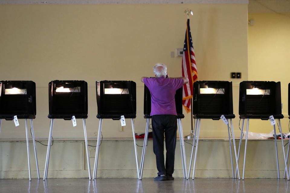 MIAMI, FL  - MARCH 17:  A voter fills out a ballot in their precinct during the Florida presidential primary as the coronavirus pandemic continues on March 17, 2020 in Miami, Florida.  People are heading to the polls to vote for their Republican and Democratic choice in their parties respective primaries during the COVID-19 outbreak. (Photo by Joe Raedle/Getty Images) ORG XMIT: 775496679 ORIG FILE ID: 1212963281