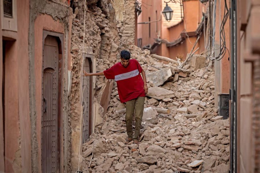 A resident navigates through the rubble following a 6.8-magnitude quake in Marrakesh on September 9, 2023. (Photo by Fadel Senna/AFP via Getty Images)