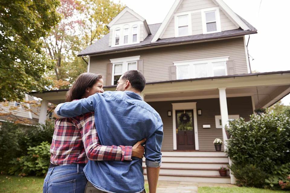 <p>Getty Images</p> Couple holds each other and walks toward home